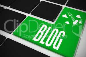 Blog on black keyboard with green key