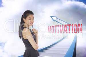 Motivation against red staircase arrow pointing up against sky