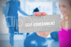 Fit blonde holding card saying self govenment