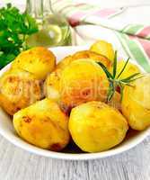 Potatoes fried in plate on board