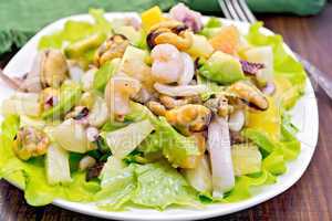 Salad seafood and avocado on board