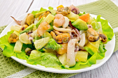 Salad seafood and avocado on light board