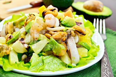 Salad seafood and avocado on napkin