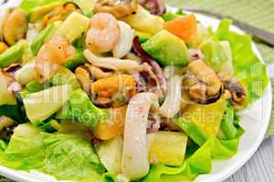 Salad seafood and lettuce on light board