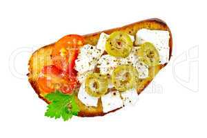 Sandwich with feta cheese and olives on top