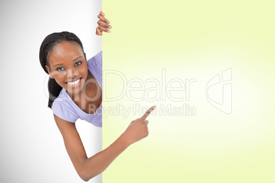 Composite image of smiling young girl showing card