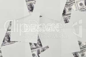 Design against white paper strewn over dollar bills