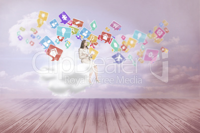 Composite image of businesswoman holding tablet and looking up