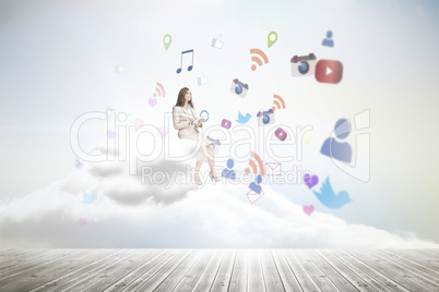 Composite image of businesswoman holding tablet and looking up