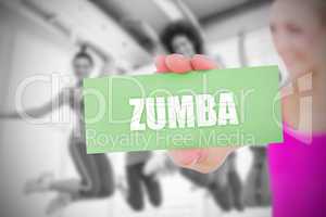 Zumba against fit blonde holding pink card