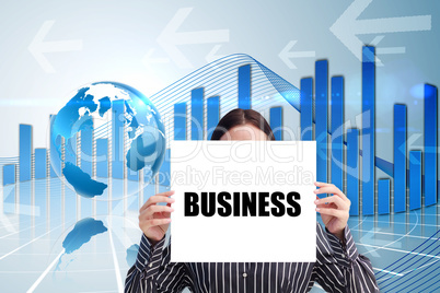 Businesswoman holding card saying business Businesswoman holding card saying business