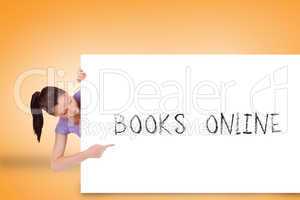 Pretty brunette showing card with books online