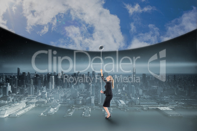 Composite image of businesswoman pulling down blue sky