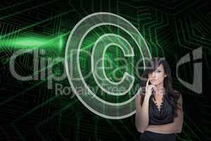 Composite image of copyright symbol and sexy brunette