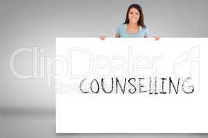 Pretty brunette showing card with counselling