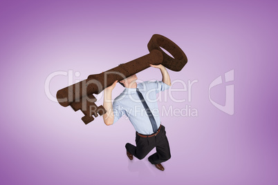 Composite image of businessman carrying large key