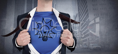 Composite image of businessman opening his shirt superhero style