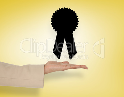 Composite image of female hand presenting merit badge