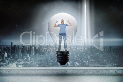 Composite image of angry woman in light bulb
