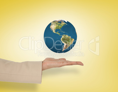 Composite image of female hand presenting earth Composite image of female hand presenting earth