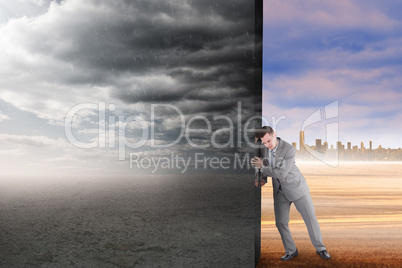 Composite image of businessman pushing away scene