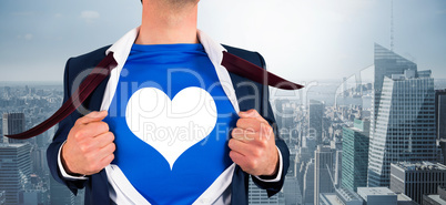 Composite image of businessman opening his shirt superhero style