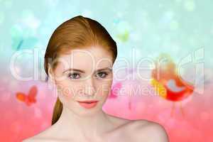 Composite image of beautiful redhead looking at camera