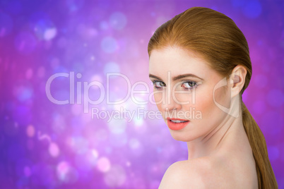 Composite image of beautiful redhead looking at camera