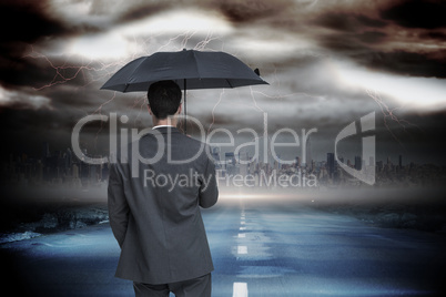 Composite image of rear view of classy businessman holding grey
