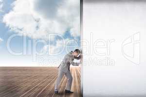 Composite image of businessman pushing away scene