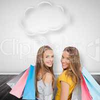 Composite image of two young women with shopping bags with speec