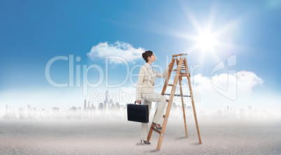 Composite image of businesswoman climbing career ladder with bri