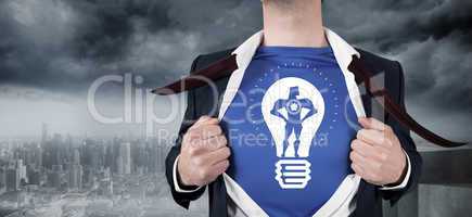 Composite image of businessman opening his shirt superhero style