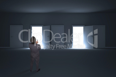 Composite image of thinking businessman holding pen