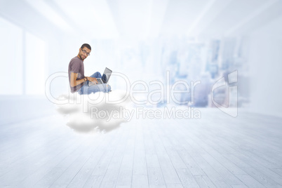 Composite image of man wearing glasses sitting on cloud using la