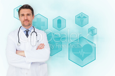 Composite image of handsome young doctor with arms crossed