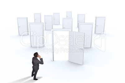 Composite image of thinking businessman scratching head