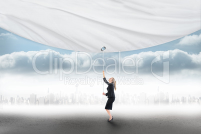 Composite image of businesswoman pulling a white screen