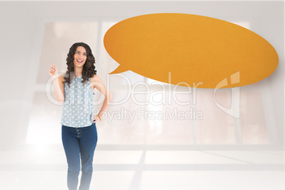 Composite image of happy beautiful brunette posing with speech b