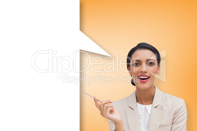 Composite image of smiling businesswoman holding a pen with spee