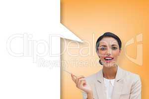 Composite image of smiling businesswoman holding a pen with spee