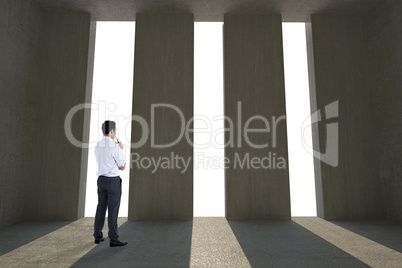 Composite image of businessman holding glasses