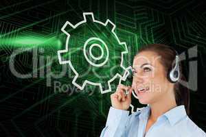 Composite image of cog and wheel with call center worker