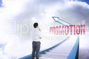 Promotion against red staircase arrow pointing up against sky