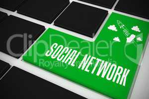 Social network on black keyboard with green key