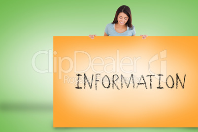 Pretty brunette showing card with information