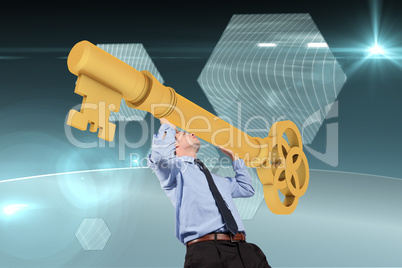 Composite image of businessman carrying large key