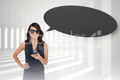 Composite image of happy brunette holding smartphone with speech