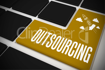 Outsourcing on black keyboard with yellow key