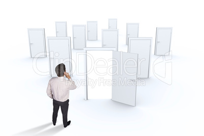 Composite image of thinking businessman touching his chin